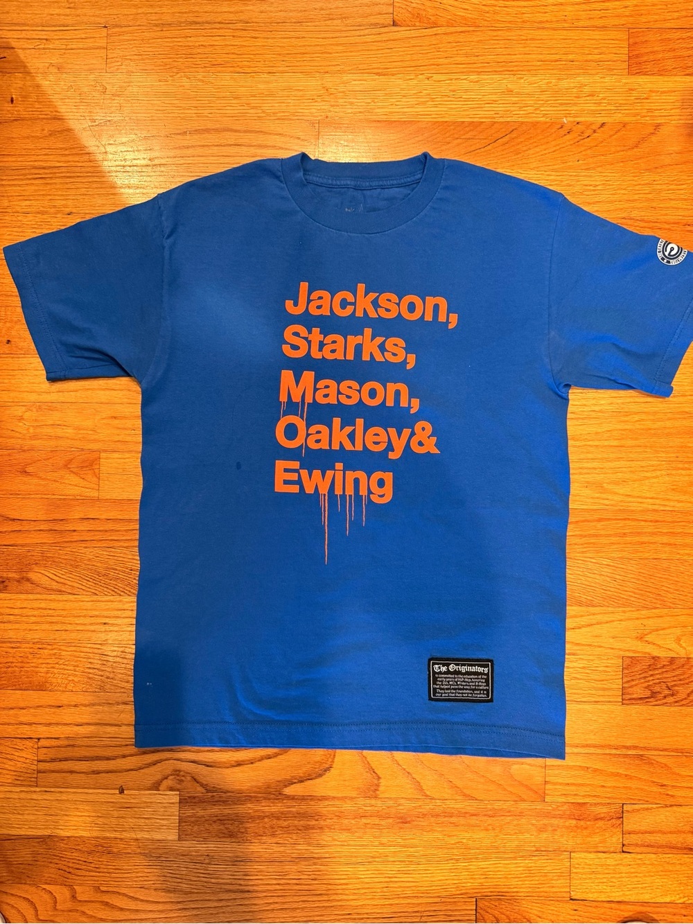 New York Knicks Blue Graphic Tee with Orange Text 90’s team.